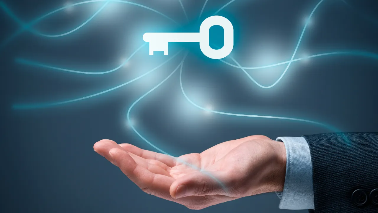 A man holding a key in his hand