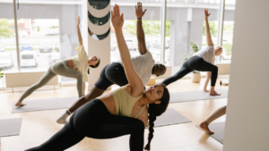 A group of individuals doing yoga.