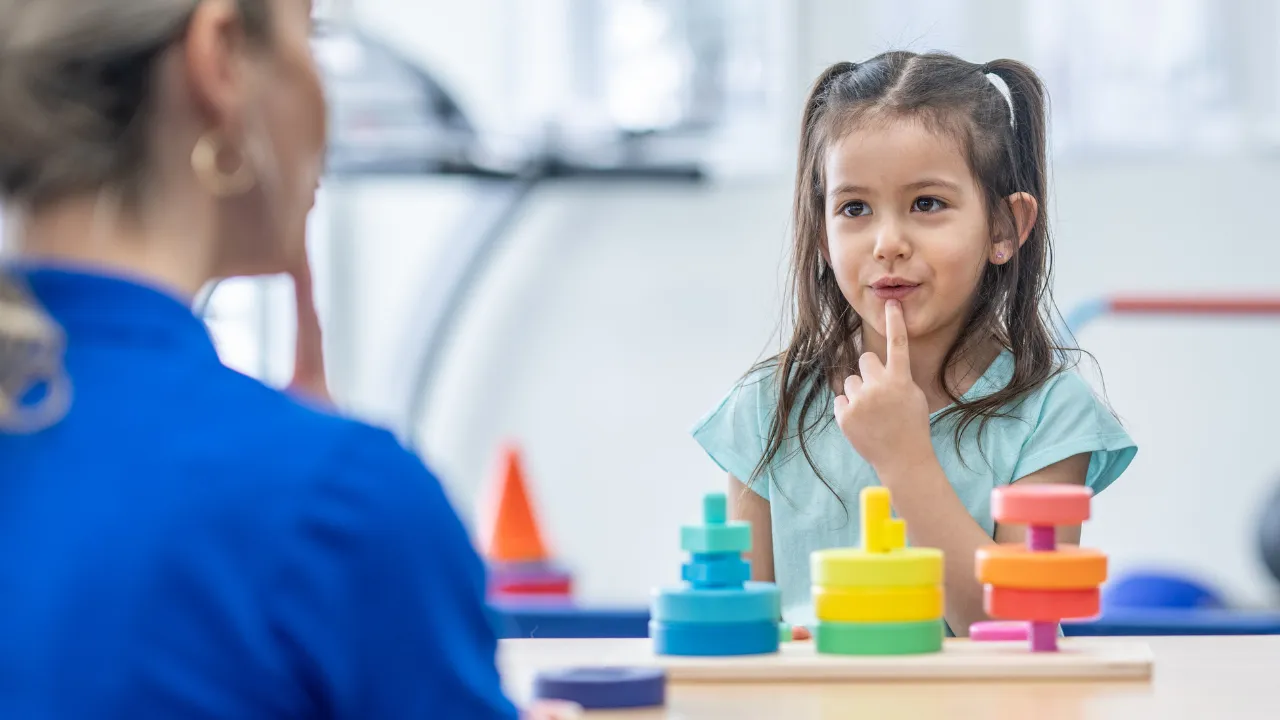 Language therapy between a child and a teacher