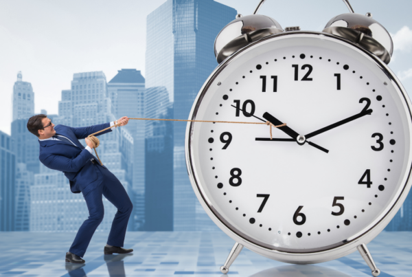 A corporate man pulling a giant clock