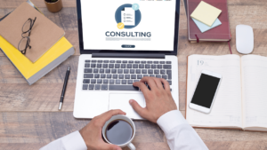 Management Consultant reviewing consulting notes on laptop