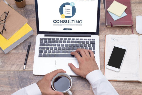 Management Consultant reviewing consulting notes on laptop | Scott Legal, P.C. Management Consultant reviewing consulting notes on laptop