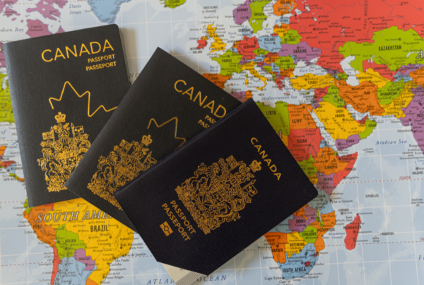Canadian passport and world map