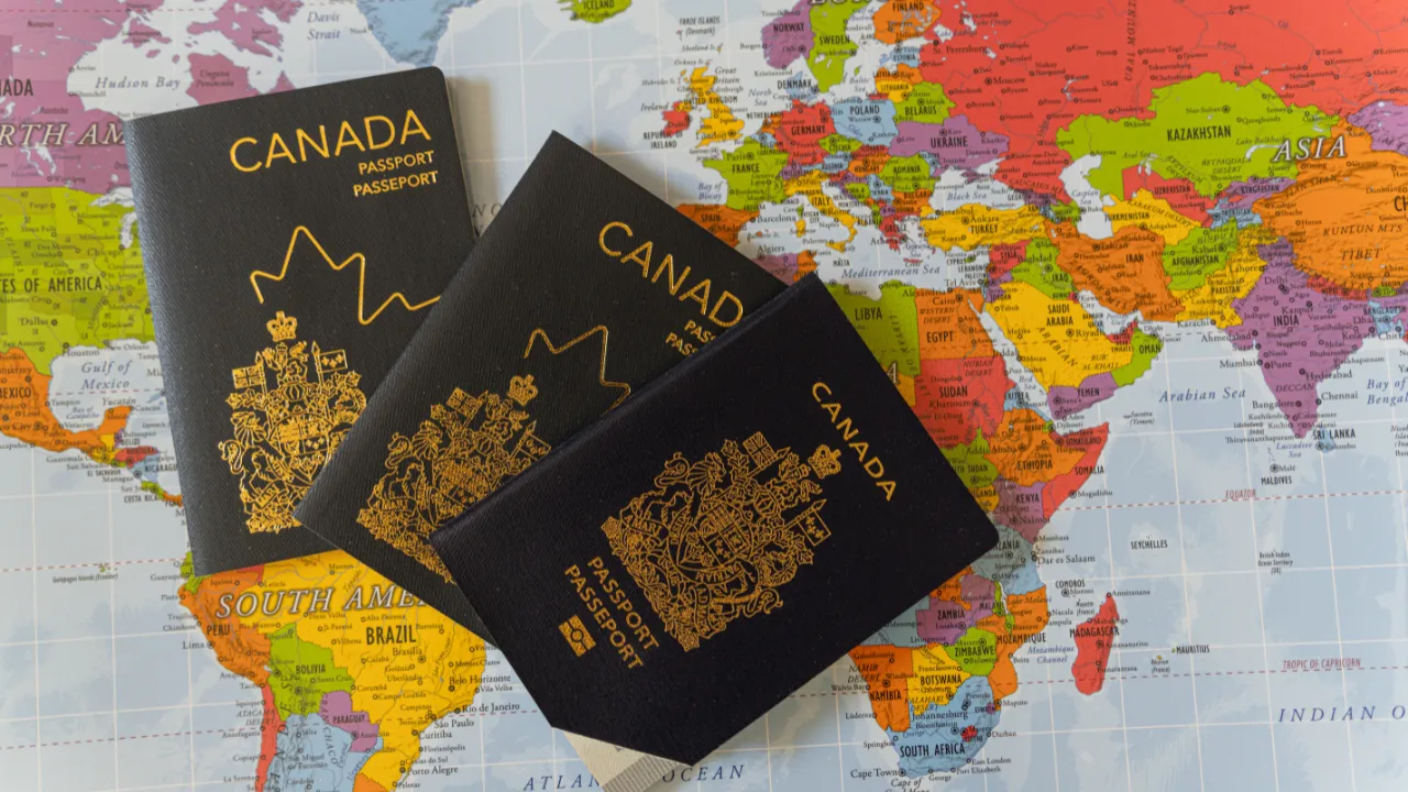 Canadian passport and world map