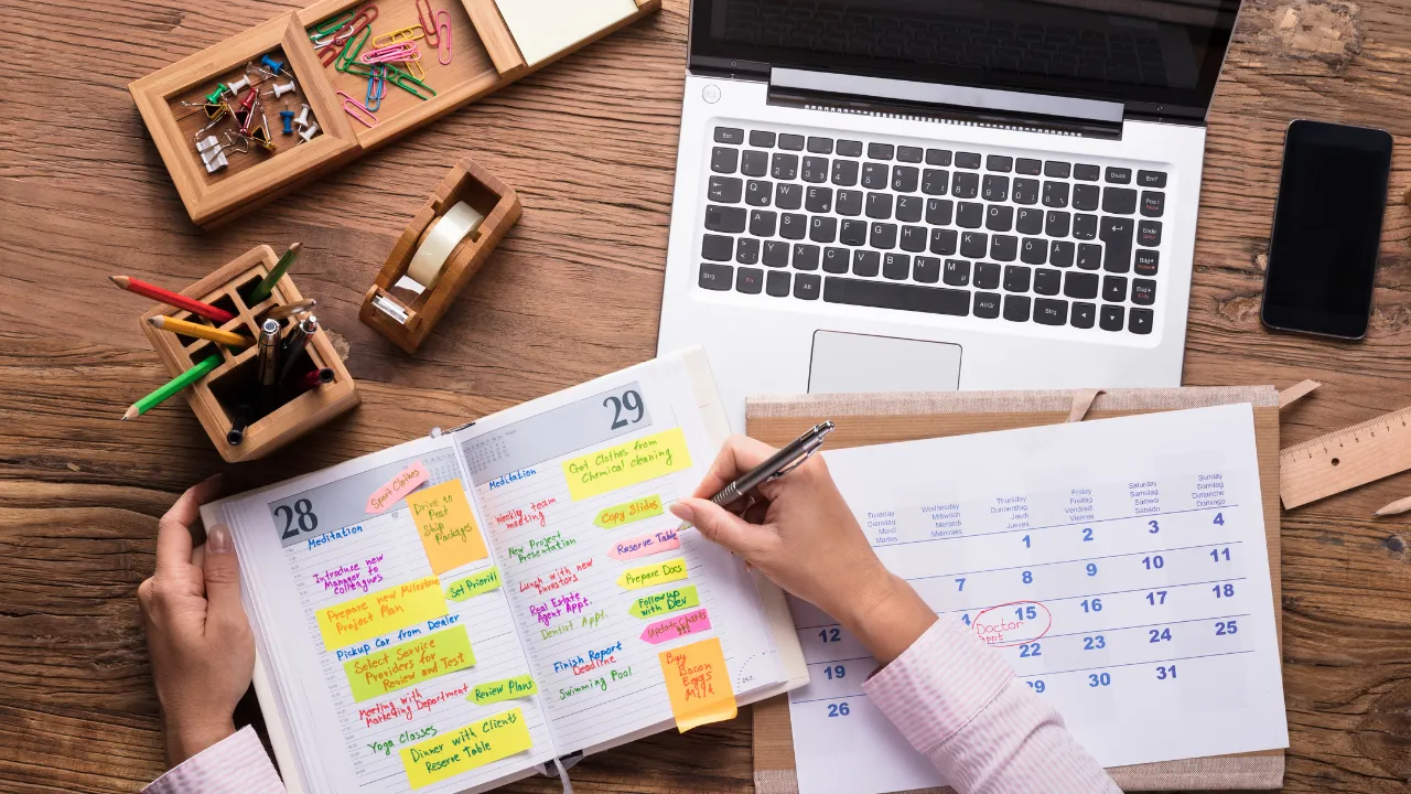 Calendar and schedule and a laptop on a table