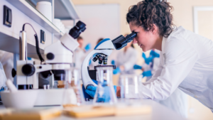 Scientist looking in a microscope