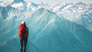 A traveler looking at the mountains ahead of her