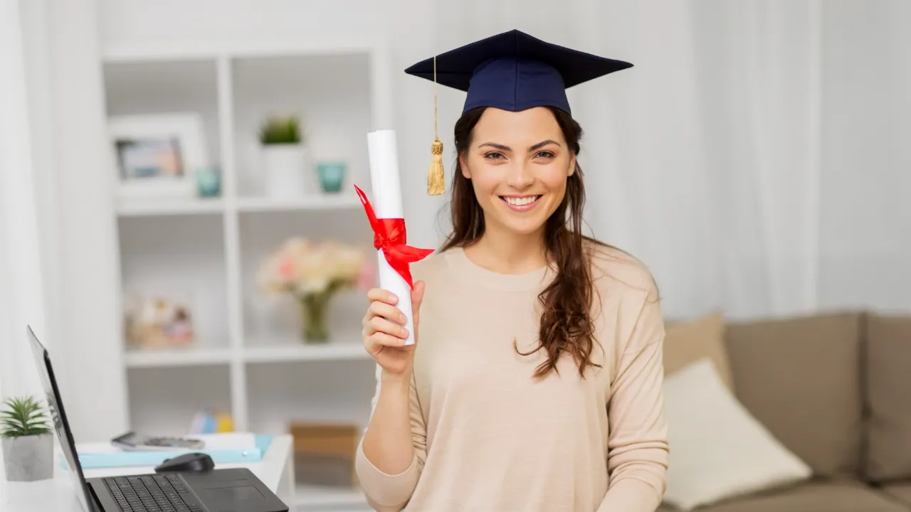 A woman holding an MBA