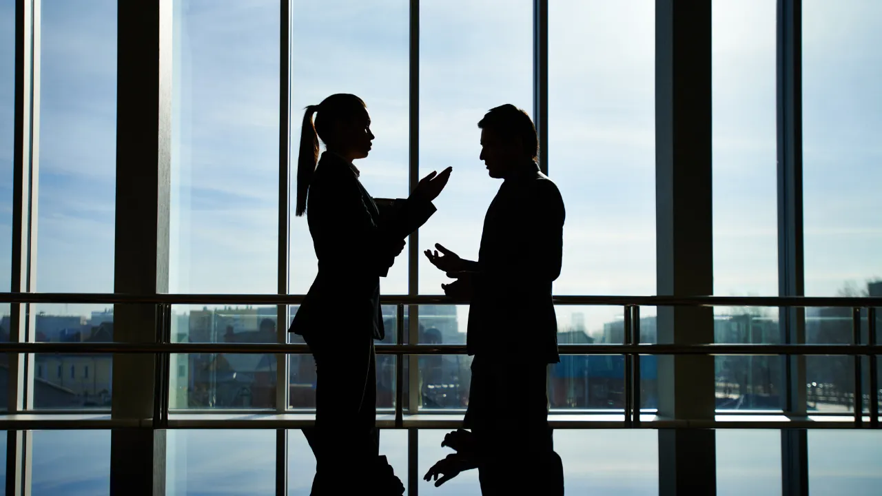 Business partners speaking