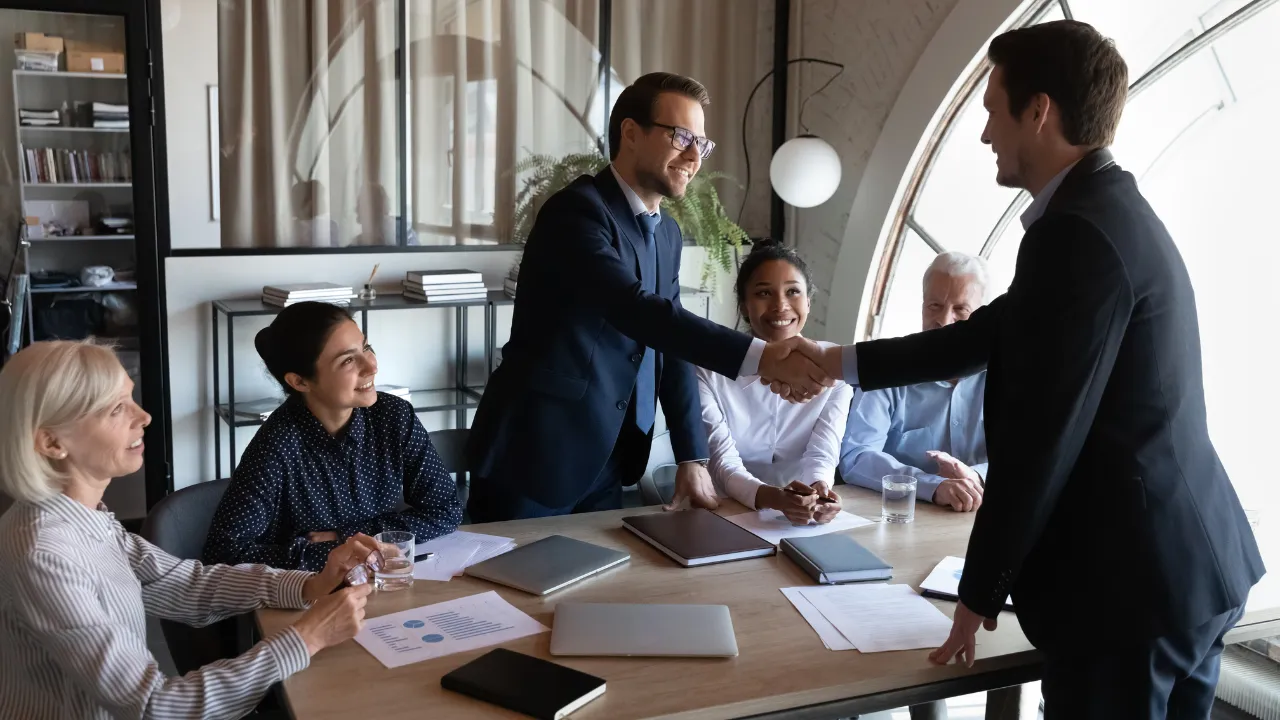 A man shaking hands with a new employer