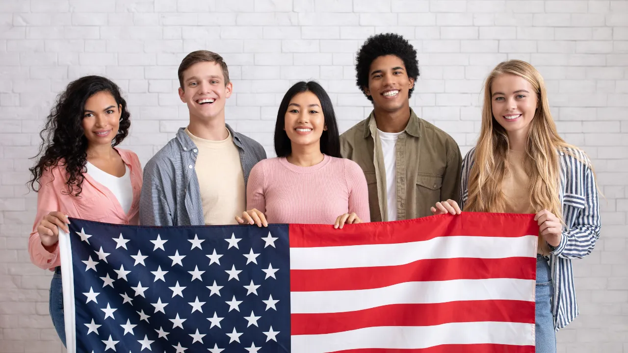 A group of people holding the US flag