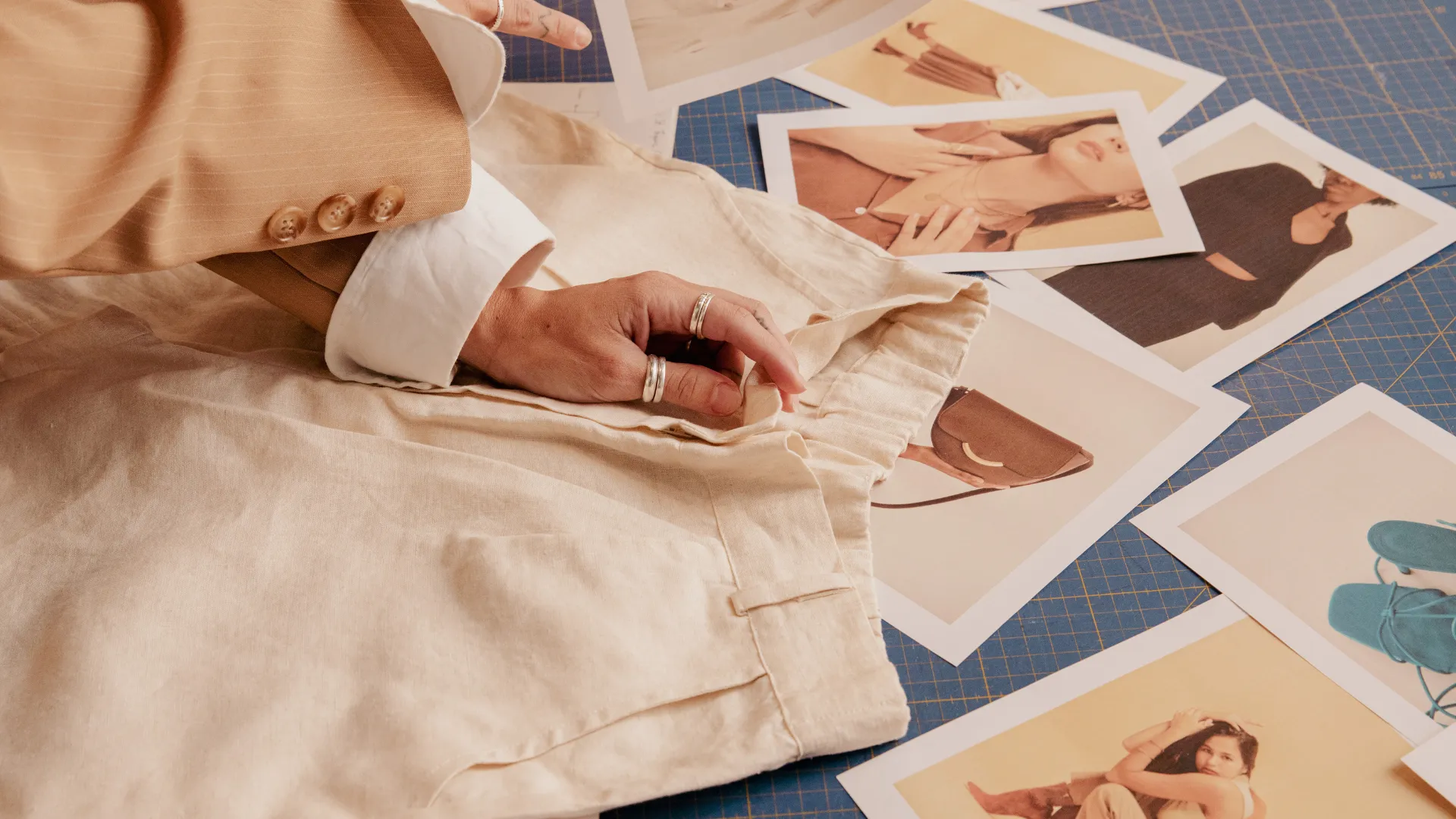 Fashion designs set out on a table