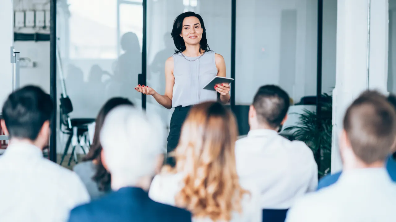 A corporate worker teaching a seminar