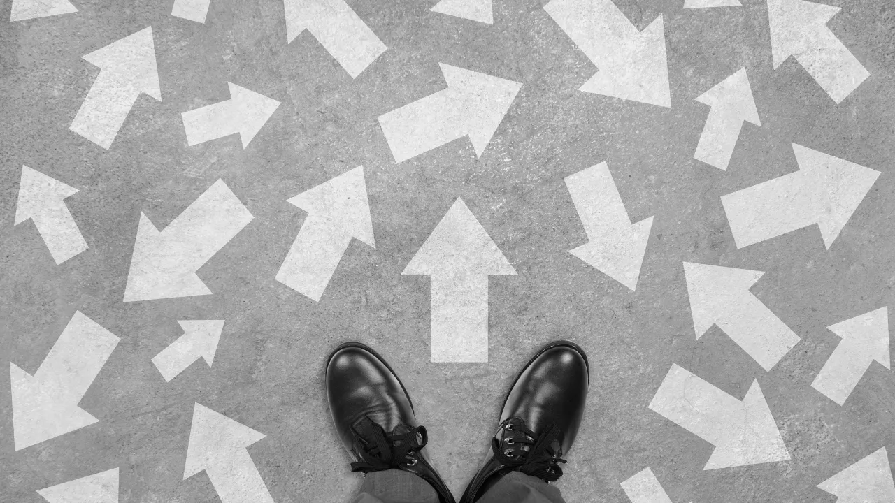 Feet and arrows on the ground as a symbol of potential options