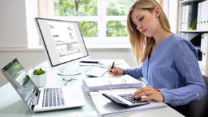 An accountant working on an invoice