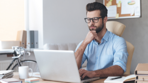 Corporate worker working from a laptop