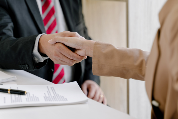 Handhsake | Scott Legal, P.C. A consultant shaking hands with a client