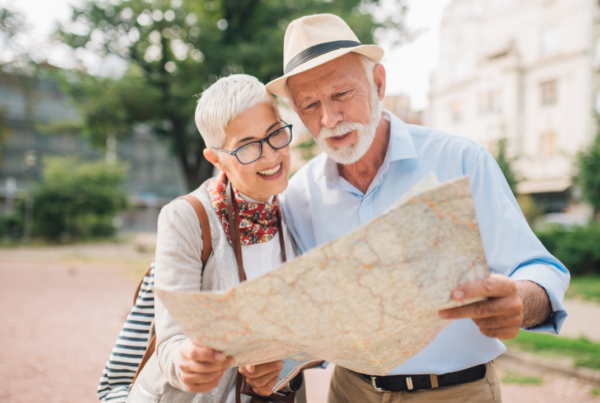 Two tourists looking at a map while travelling