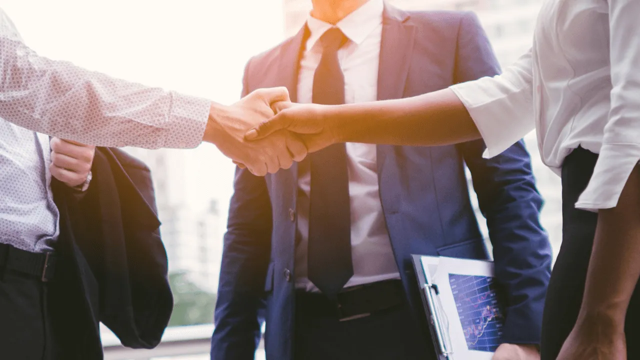 Business man and woman shaking hands