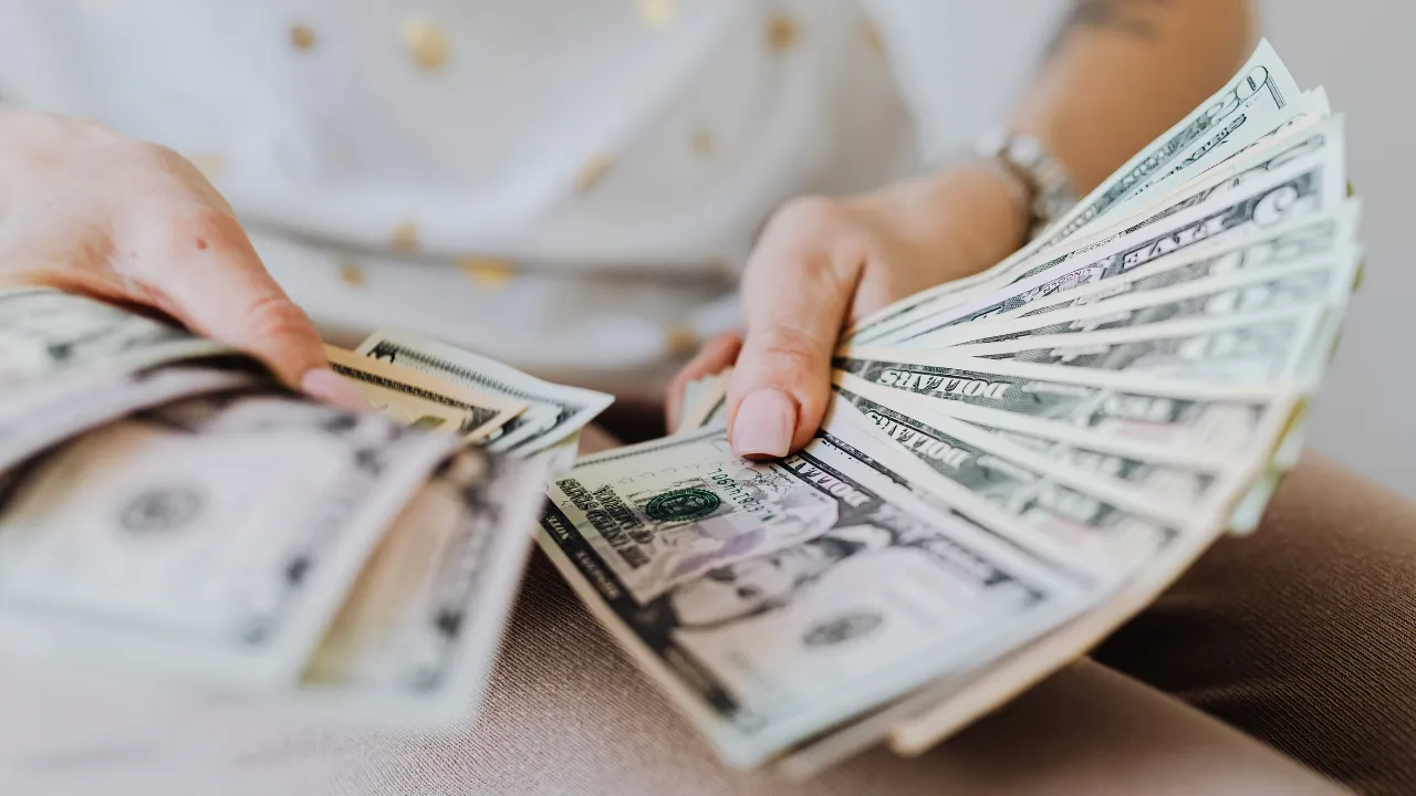 a woman holding money