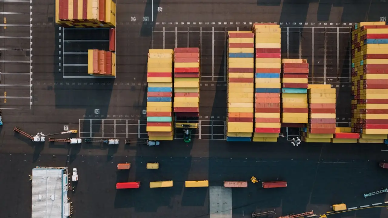 Shipping containers at port representing substantial international trade under the E-1 visa