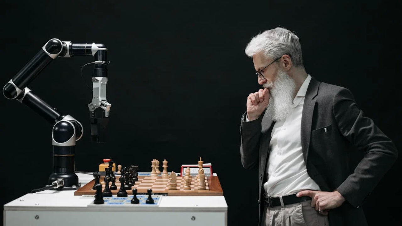 Man strategizing in a chess game against a robot arm, symbolizing NIW and H-1B immigration planning