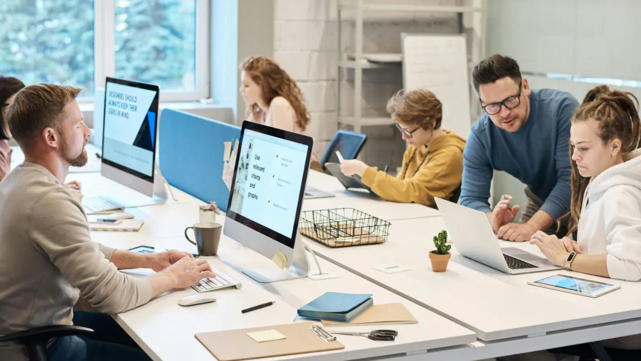 A team of professionals working in a modern office, representing individuals who have successfully navigated the NIW process to gain work authorization.