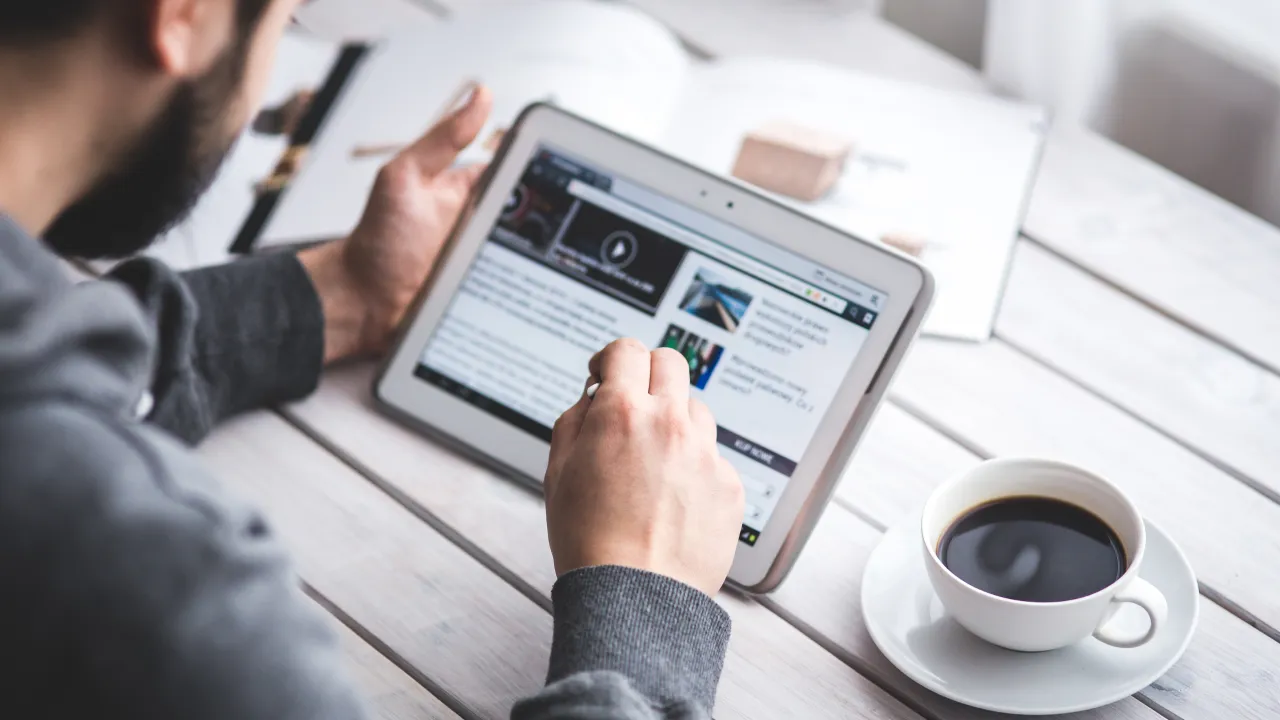 A close-up of a worried woman in professional attire looking intently at an official immigration document with complicated text and dates, representing the end of automatic EAD extensions.