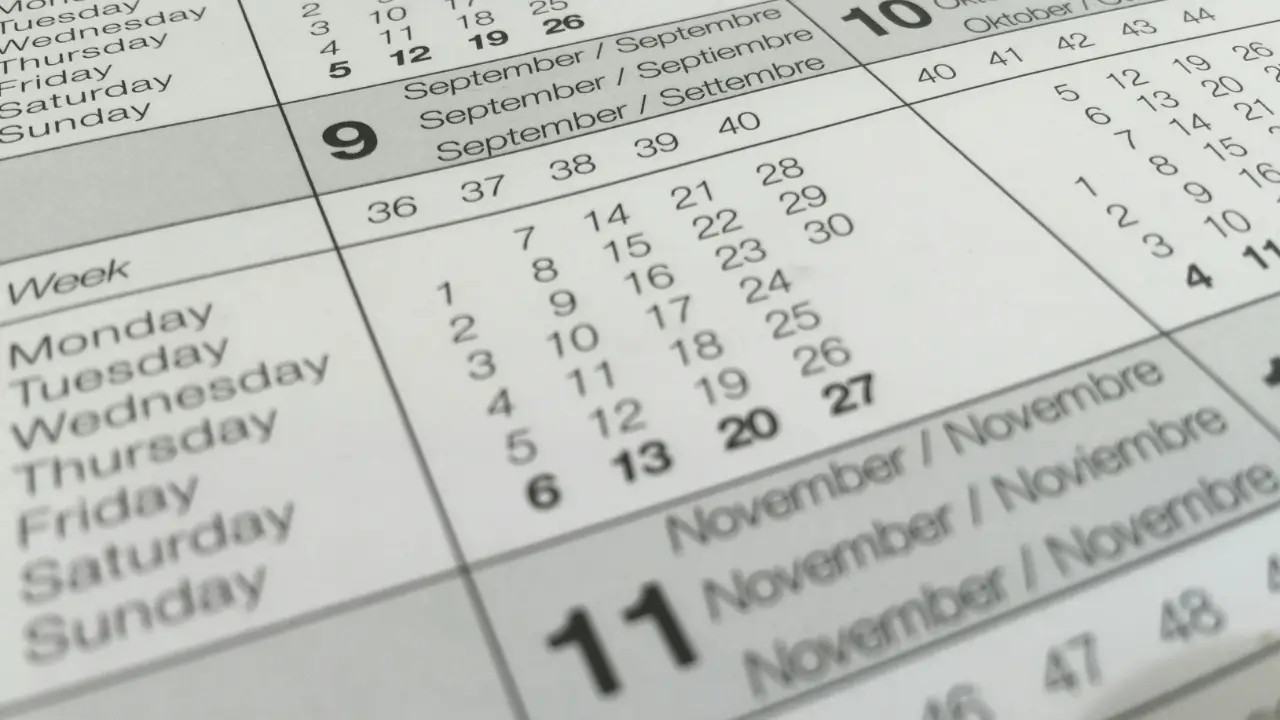 A close-up of a calendar, representing the long waiting periods caused by NIW priority date retrogression.