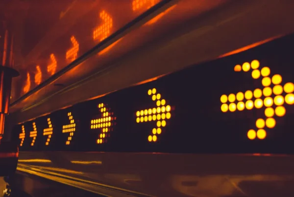 Illuminated digital arrows pointing to the right, representing the next steps in the immigration process after I-140 approval.