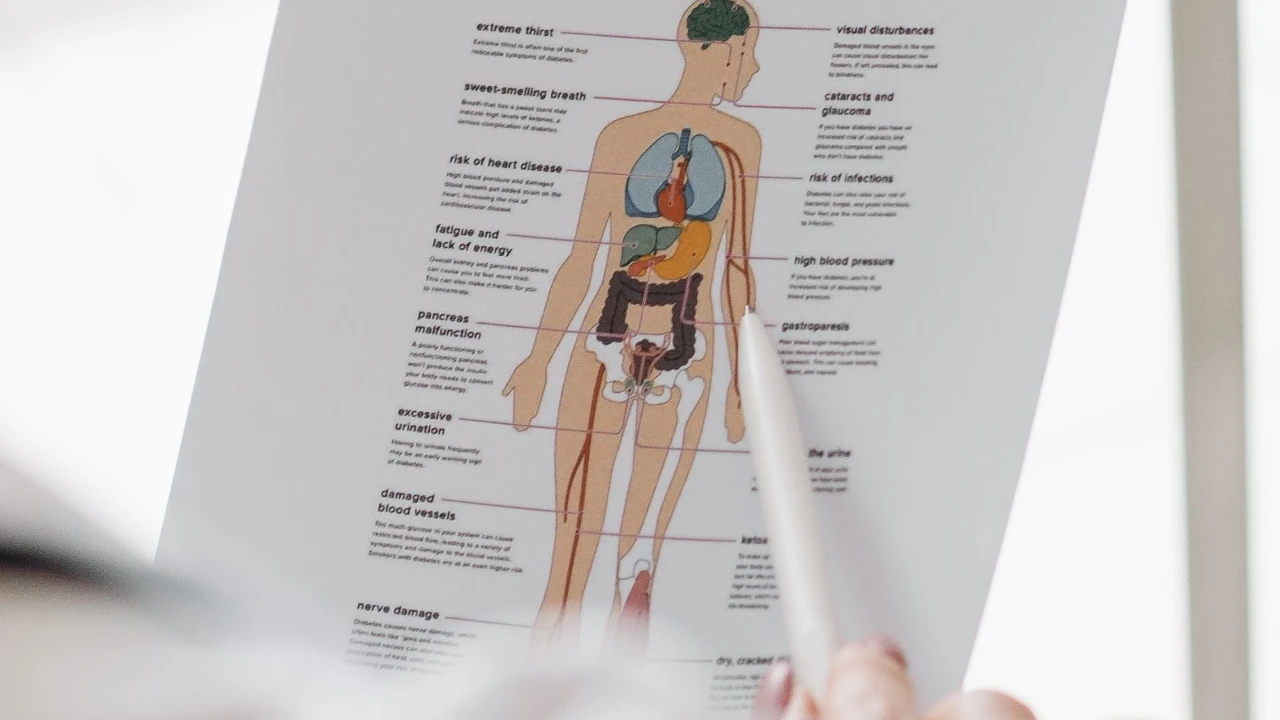 Person reviewing a diabetes information sheet next to a glucose monitoring device and educational cards on a table