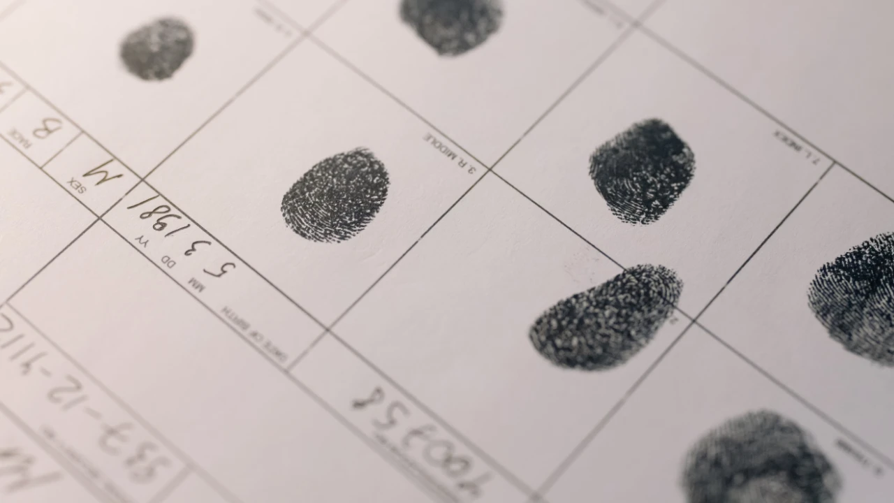 Close-up of a fingerprint card used in USCIS criminal background and biometrics checks for immigration applicants